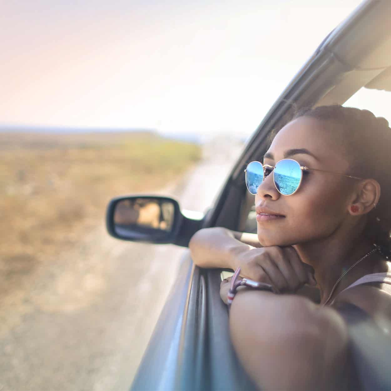 woman watching out the window during sober transportation