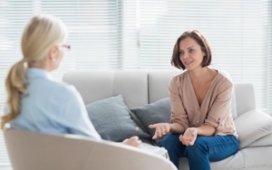 Picture of a woman at home talking to a counselor