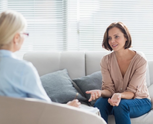 Picture of a woman at home talking to a counselor