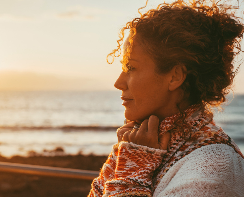 Enjoyed and serene lady dreaming and thinking outdoor